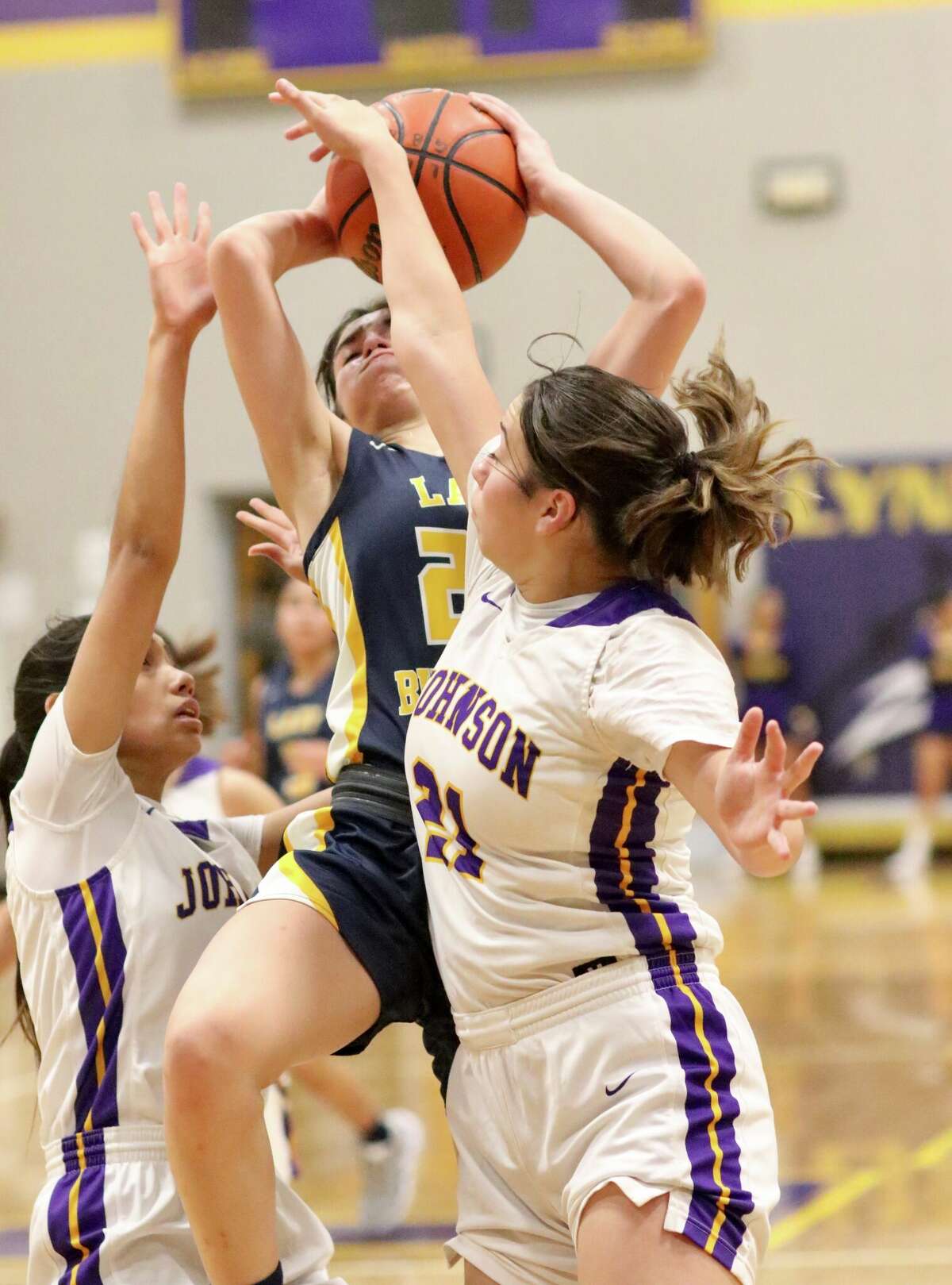 The Alexander Lady Bulldogs beat the LBJ Lady Wolves in double overtime on Friday.