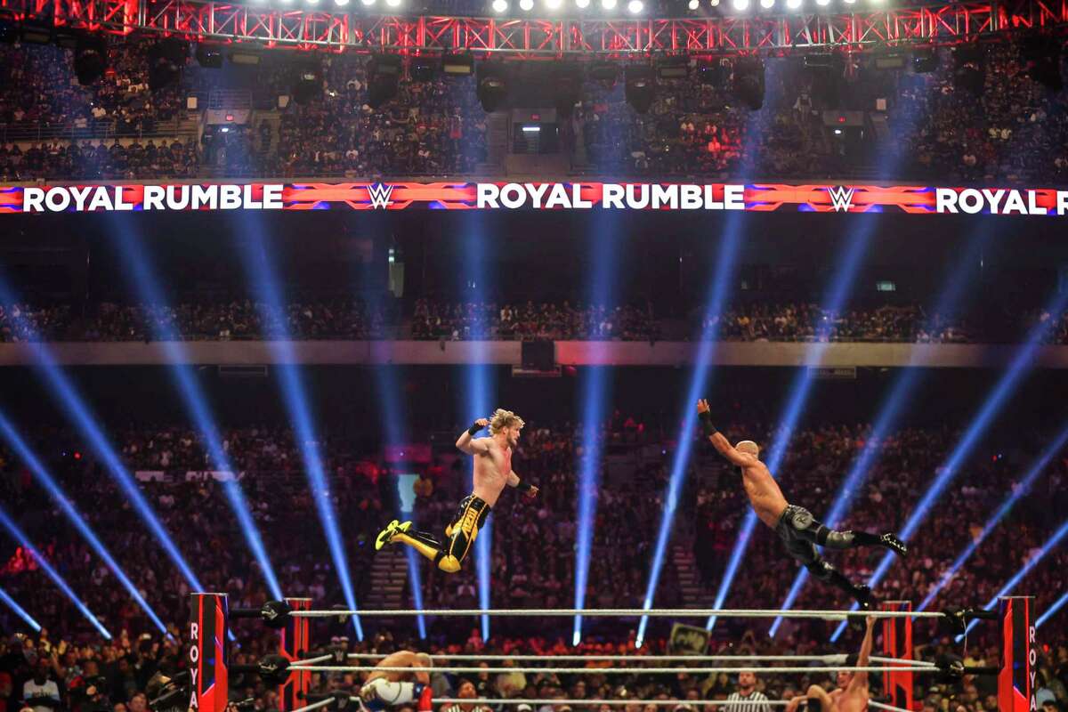 WWE superstars Logan Paul and Ricochet fly towards each other during a match in the WWE Royal Rumble held at The Alamodome in San Antonio, Texas, on Jan. 28, 2023.