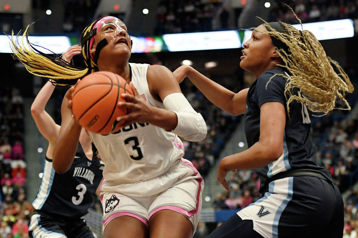 UConn's Aaliyah Edwards (3) is guarded by Villanova's Christina Dalce in the first half of an NCAA college basketball game, Sunday, Jan. 29, 2023, in Hartford, Conn. (AP Photo/Jessica Hill)