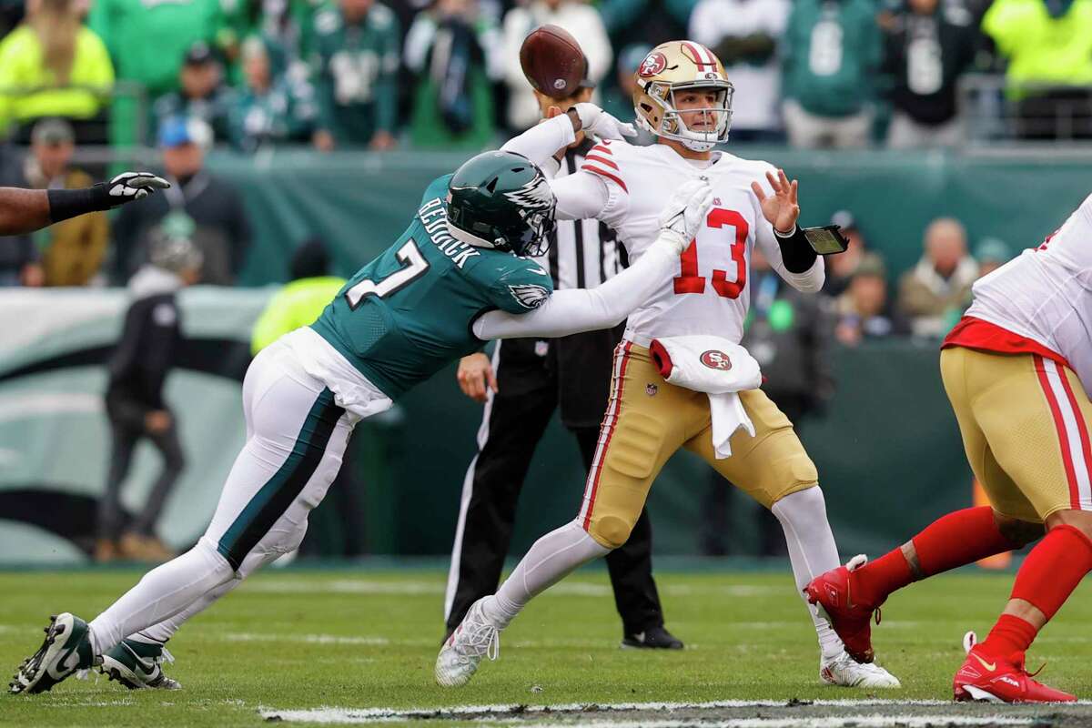 Eagles linebacker Haason Reddick hits 49ers quarterback Brock Purdy early in the first quarter, causing a fumble. Purdy hurt his right elbow on the play.