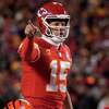Kansas City Chiefs quarterback Patrick Mahomes signals teammates during the first half of the NFL AFC Championship playoff football game against the Cincinnati Bengals, Sunday, Jan. 29, 2023, in Kansas City, Mo.
