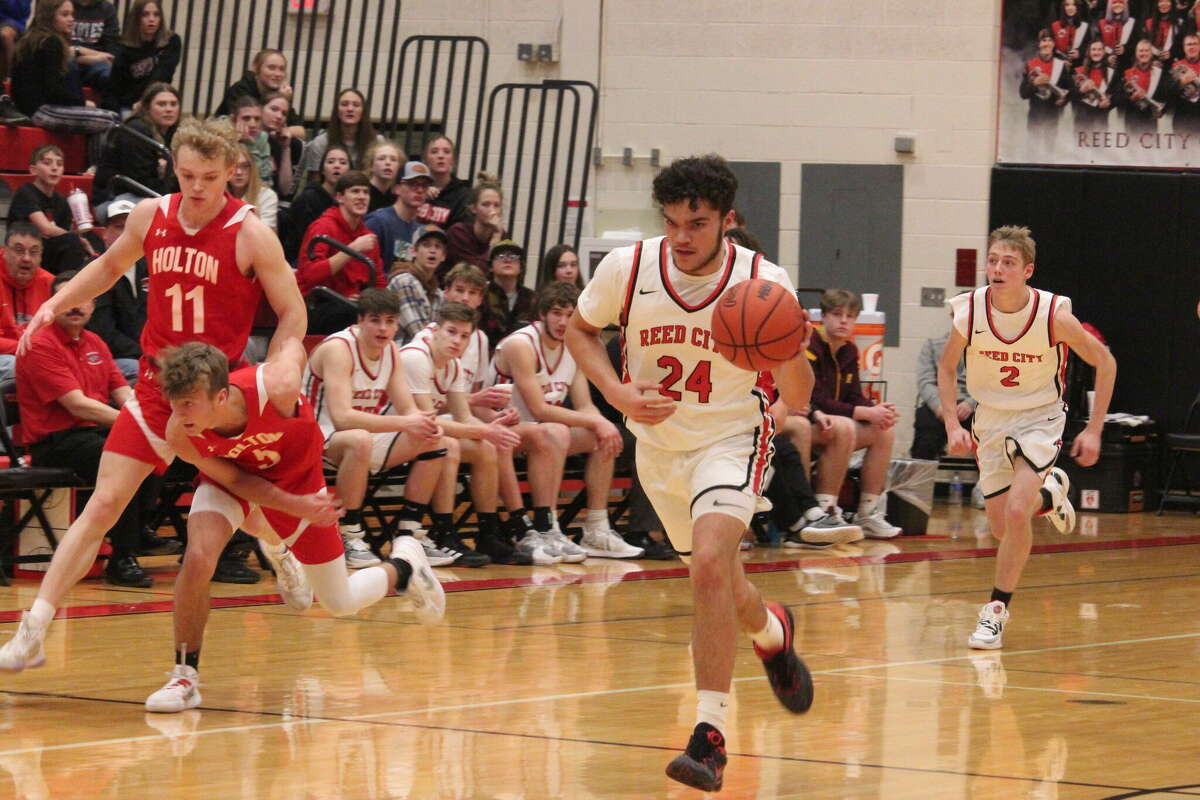 Xavier Allen (24) dribbles down the court in a game earlier this season against Holton.