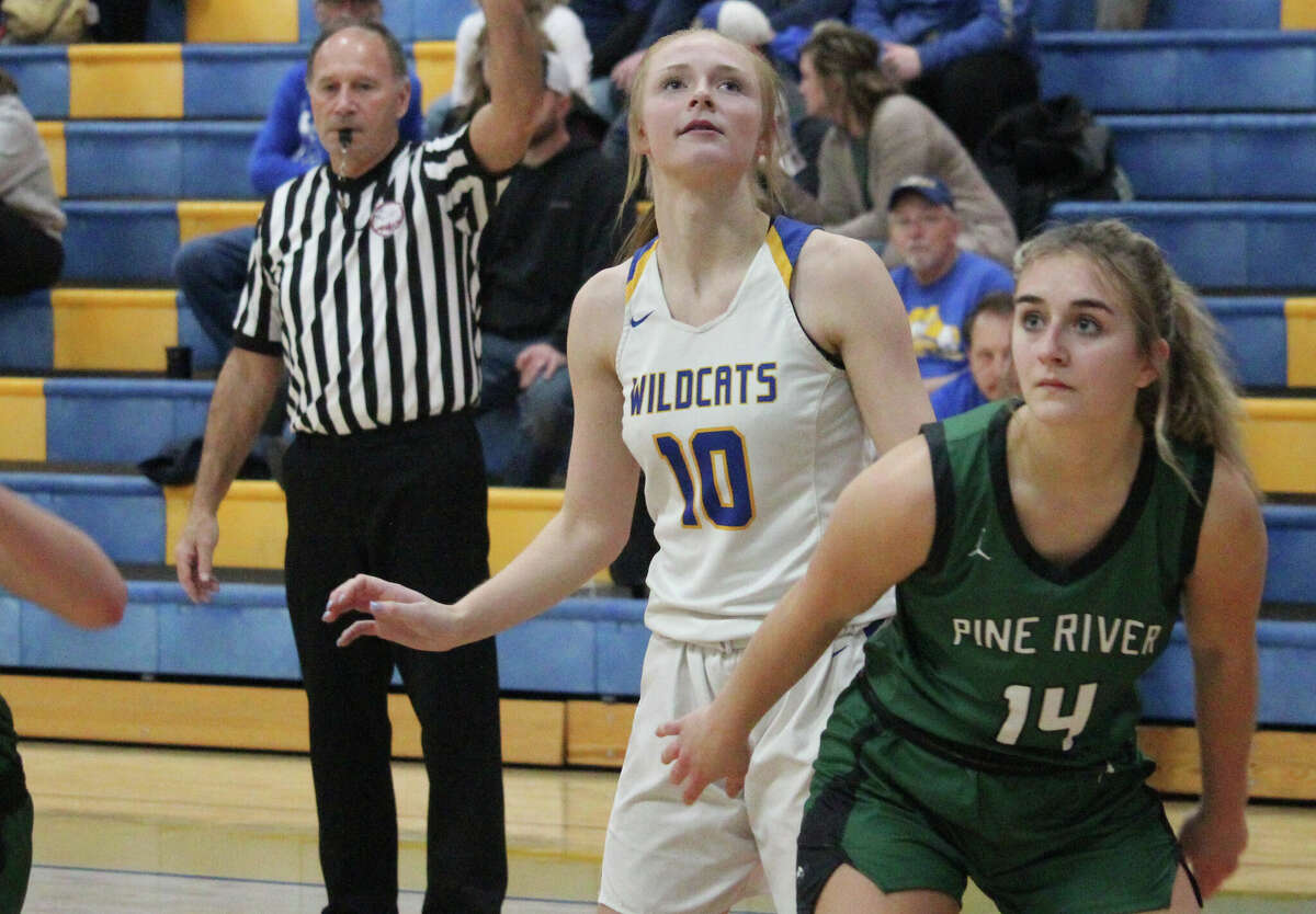 Evart's Emma Dyer gets ready to contest Pine River's Madi Sparks for a rebound during a recent game.