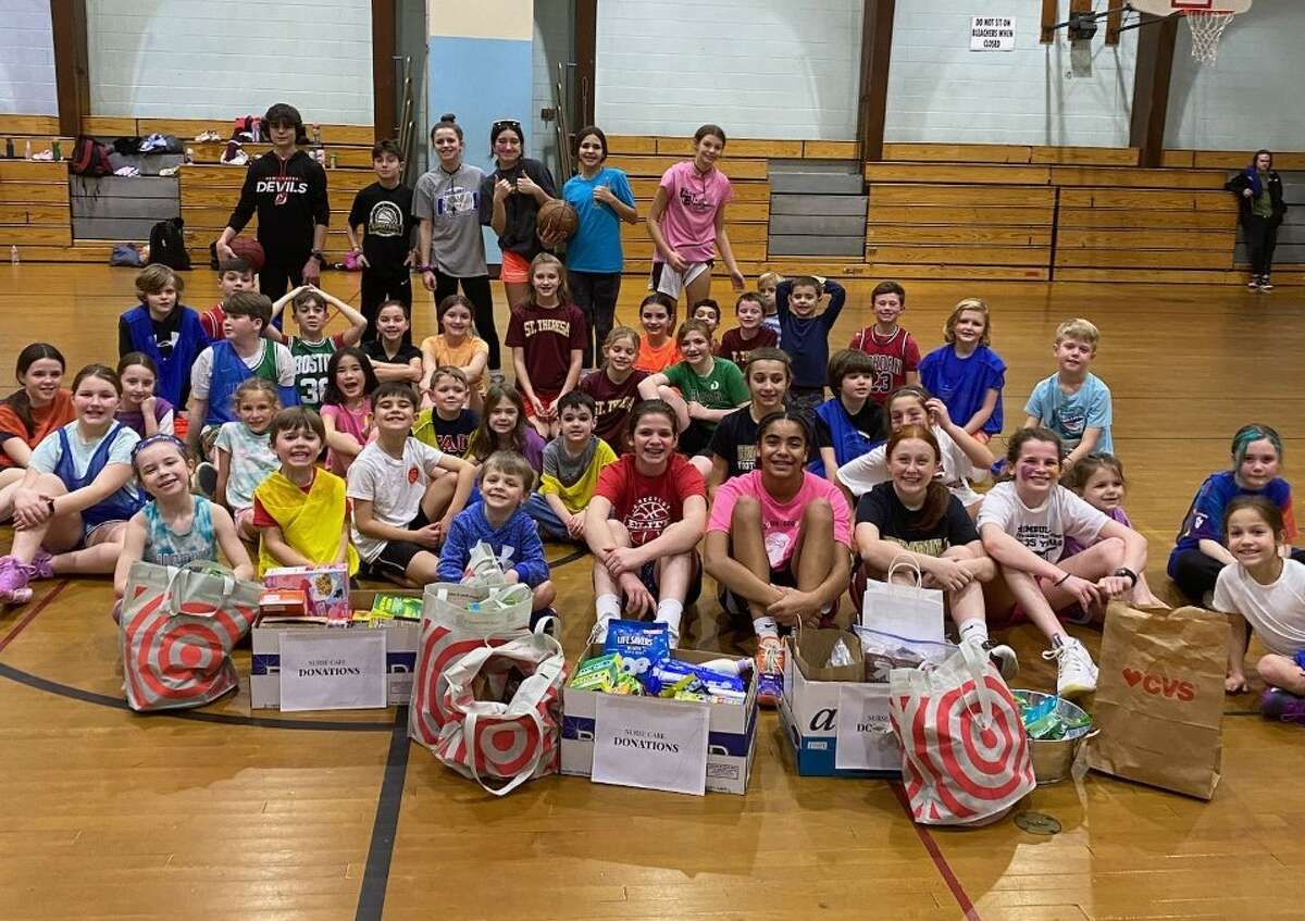 Hillcrest Middle School eighth graders Emma Fahy, Ella Grenier, Kylie Manuel, and Quinn Mellinger hosted a basketball clinic at the school Jan. 13. As part of the event, participants brought donations that the four students turned into gift bags for nurses at the town’s schools and Yale New Haven Hospital. 