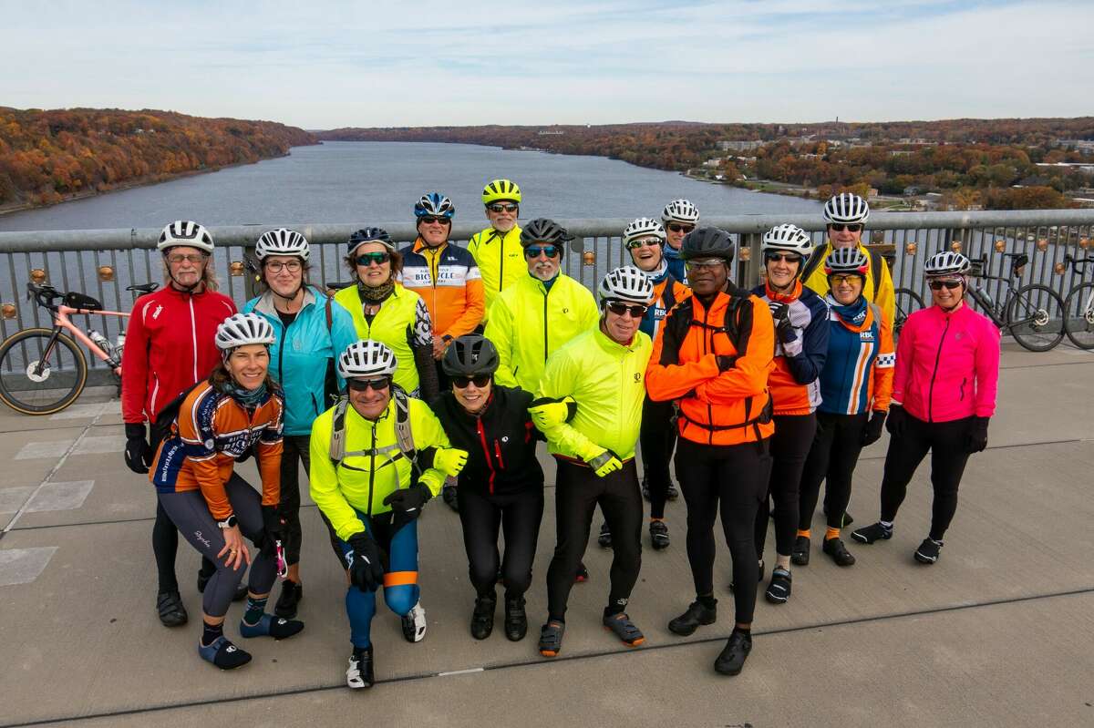Ridgefield Bicycle Club members stop on the Walk Way Over the Hudson for a group photo before proceeding on to the Culinary Institute of America for a gourmet lunch. Photo by Chuck May