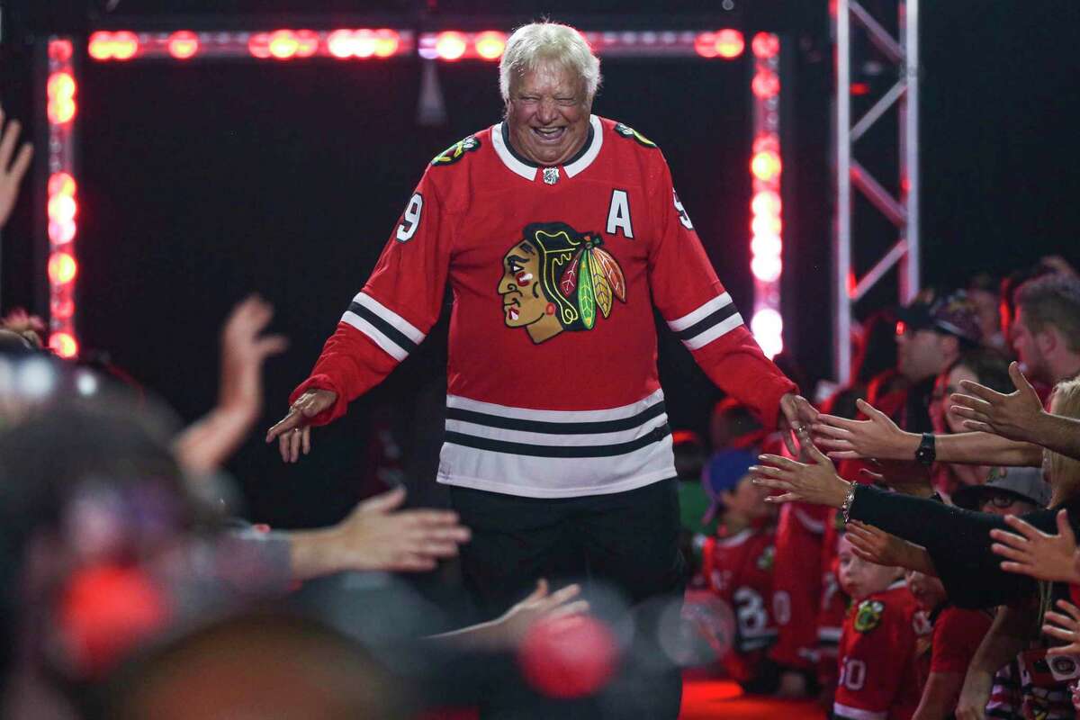 FILE - Former Chicago Blackhawks player Bobby Hull is introduced to fans during the NHL hockey team's convention in Chicago, July 26, 2019. Hull, a Hall of Fame forward who helped the Blackhawks win the 1961 Stanley Cup Final, has died. He was 84. The Blackhawks and the NHL Alumni Association announced the death of the two-time NHL MVP on Monday, Jan. 30, 2023. (AP Photo/Amr Alfiky, file)