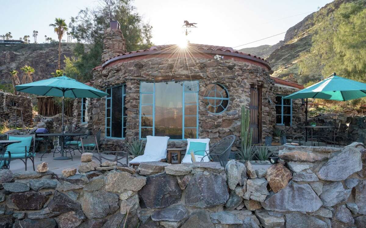 The Rock House is a little rustic gem that could almost be mistaken for part of the rocky hillside in Palm Springs, Calif.