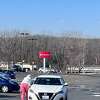 A woman struggles to regain her footing after thieves stole her purse in the parking lot of Walmart in Southington Monday. Police say the car they were in had been stolen. The purse-snatching is the latest of a series of similar crimes. 