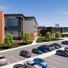 Renderings show the exterior of the new Norwalk High School, which is expected to start construction at the end of the 2023 football season. The school will be built on the existing athletic fields. 
