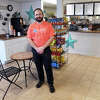 Owner Joe Fancher poses at Harbor Street Market, in Milford, Conn. Jan. 30. 2023.