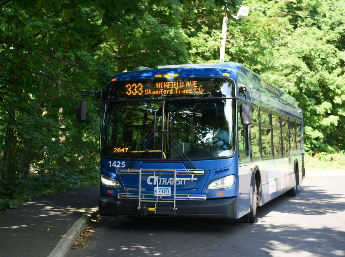 A CT Transit bus pulls up to the stop near Davenport Ridge Elementary School in Stamford, Conn., on Thursday, July 21, 2022.