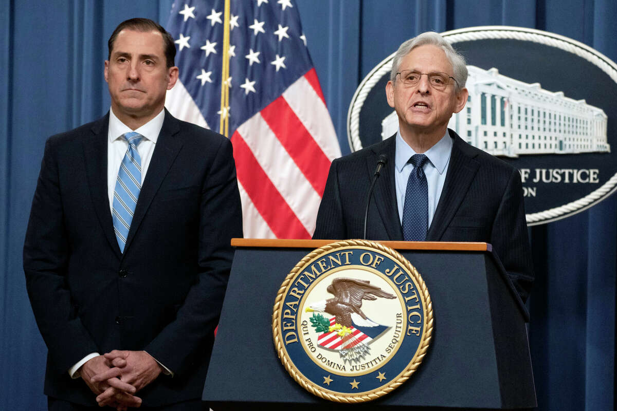 Attorney General Merrick Garland speaks during a news conference at the Department of Justice, Thursday, Jan. 12, 2023, in Washington, as John Lausch, the U.S. Attorney in Chicago, looks on. 