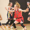 Morgan Hammond (21) applies the defensive pressure for Reed City in a game earlier this season.