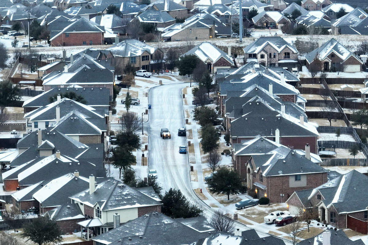 An icy mix covers a subdivision on Monday, Jan. 30, 2023, in Roanoke, Texas. Dallas and other parts of North Texas are under a winter storm warning through Wednesday. 