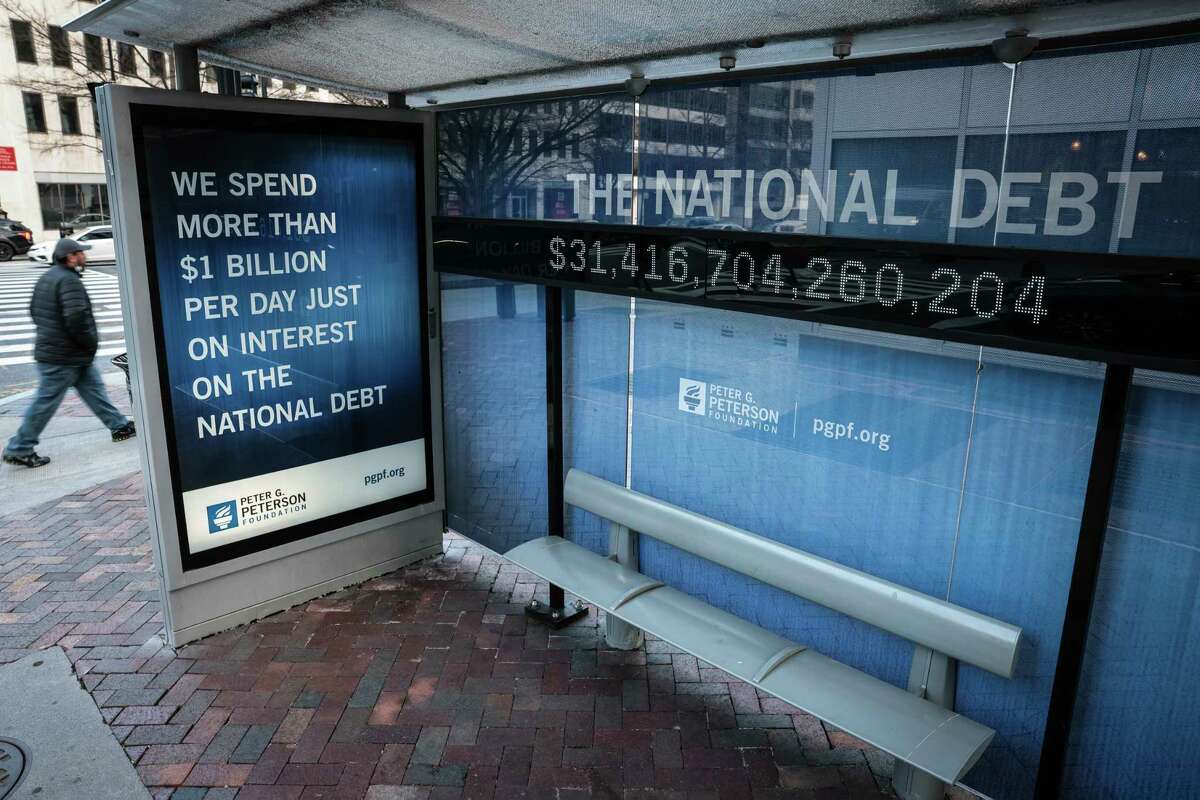 The national debt counter at a bus stop in Washington, Jan. 20, 2023. A renewed focus on fiscal restraint in the debt limit standoff with Democrats poses its own political risks.