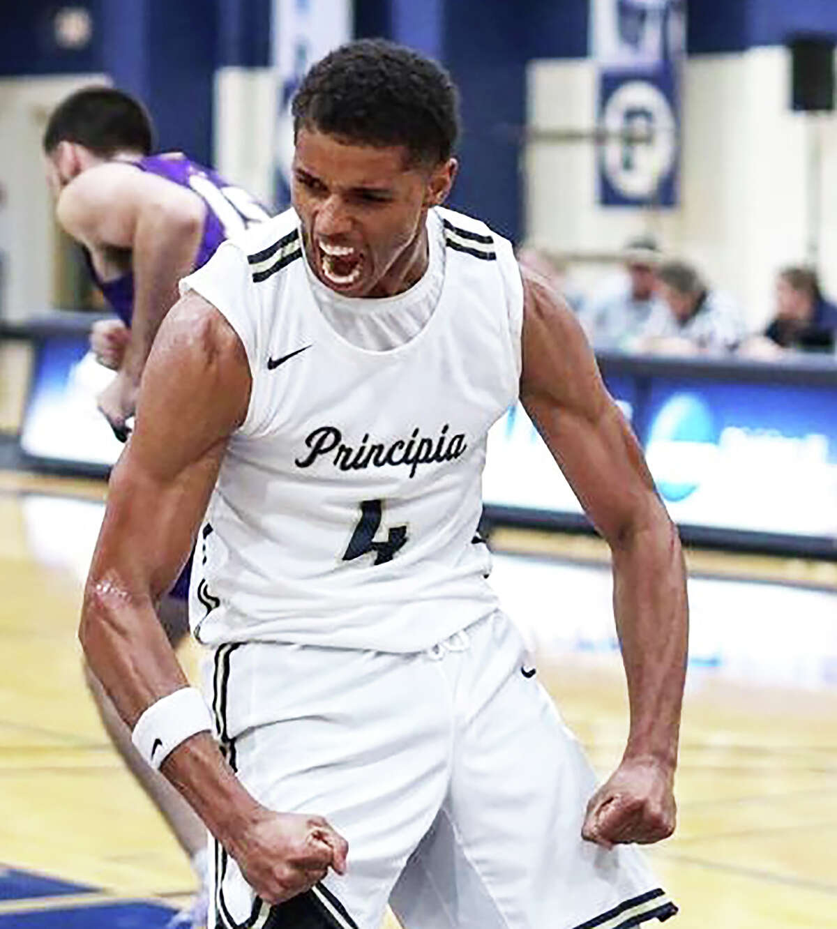 Jaquan Adams of Principia College reacts after a basket this season in Elsah. Adams is a graduate of Civic Memorial High and Lewis and Clark Community College.