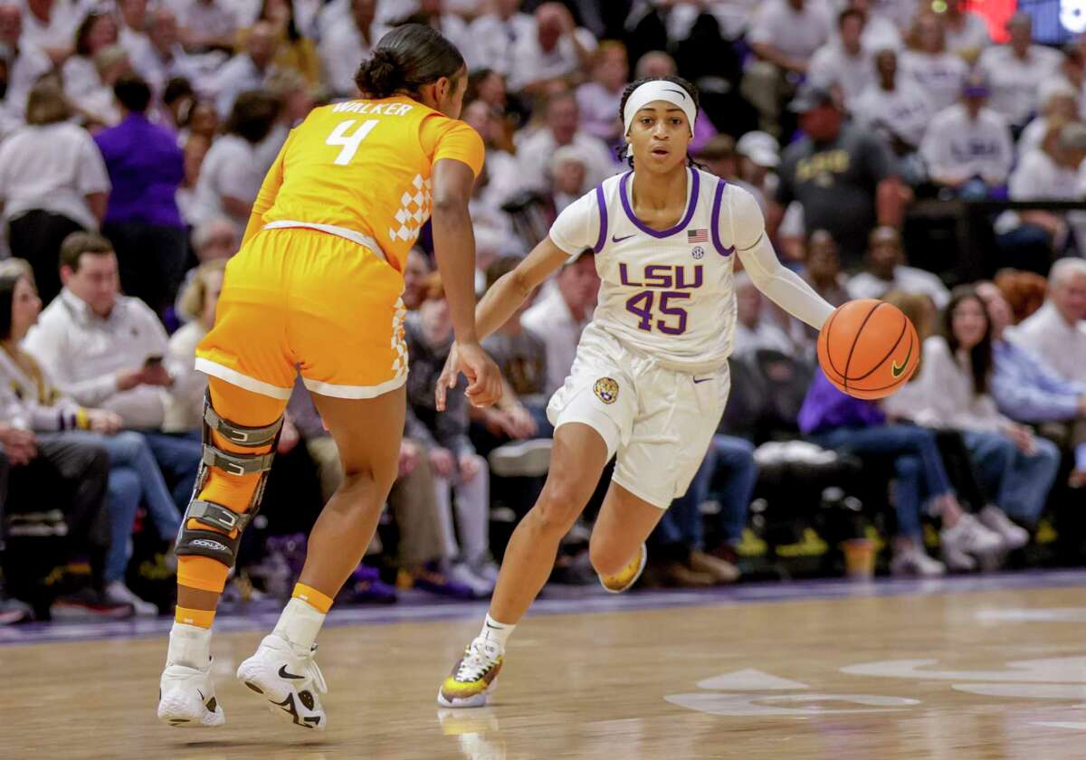 LSU guard Alexis Morris (45) drives past Tennessee guard Jordan Walker (4) in the first half of an NCAA college basketball game in Baton Rouge, La., Monday, Jan. 30, 2023. (AP Photo/Derick Hingle)