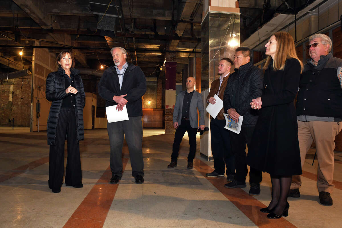 Mimi Sternlicht, left, a philanthropist from Greenwich, stands with Career Resources President Scott Wilderman during a tour of the future site of The Bridge on Main, a collaborative resource center planned for downtown Bridgeport, Conn., Jan. 31, 2023.