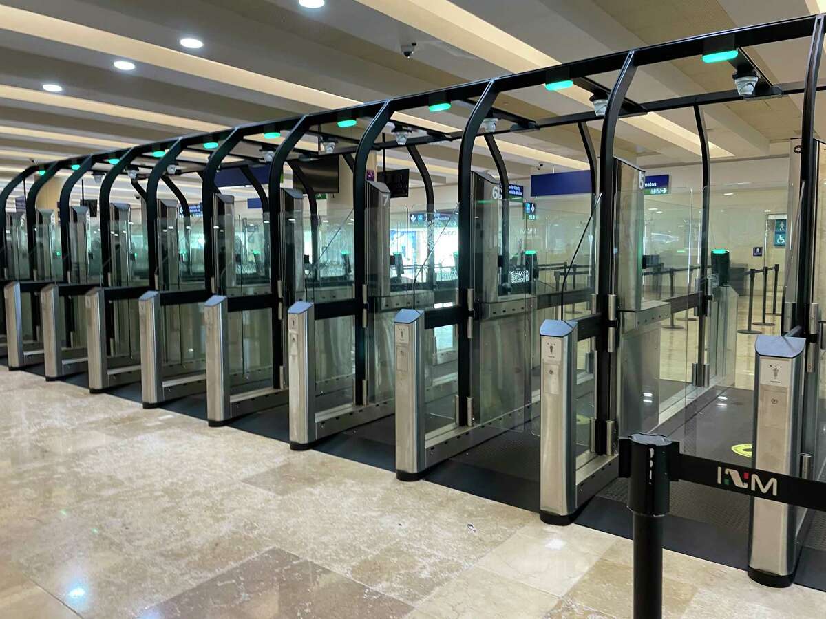 The e-gates at Cancún International Airport in Mexico allow passengers to clear passport control without long lines or face-to-face interviews with officers.
