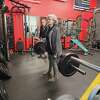 Manistee's Paula Laws (center) works on her deadlift form during a training session on Jan. 30, 2023. 