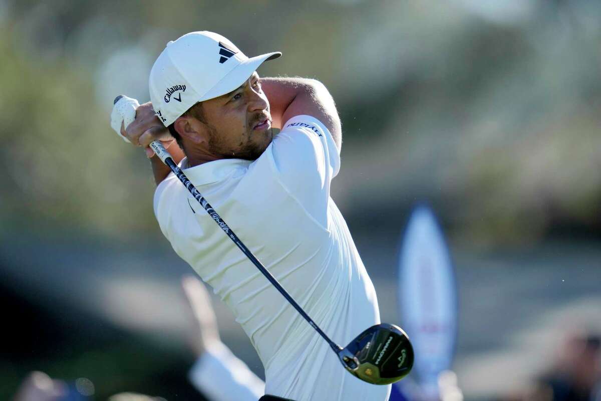 Xander Schauffele watches his tee shot on the 10th hole of the North Course at Torrey Pines during the first round of the Farmers Insurance Open golf tournament, Wednesday, Jan. 25, 2023, in San Diego.