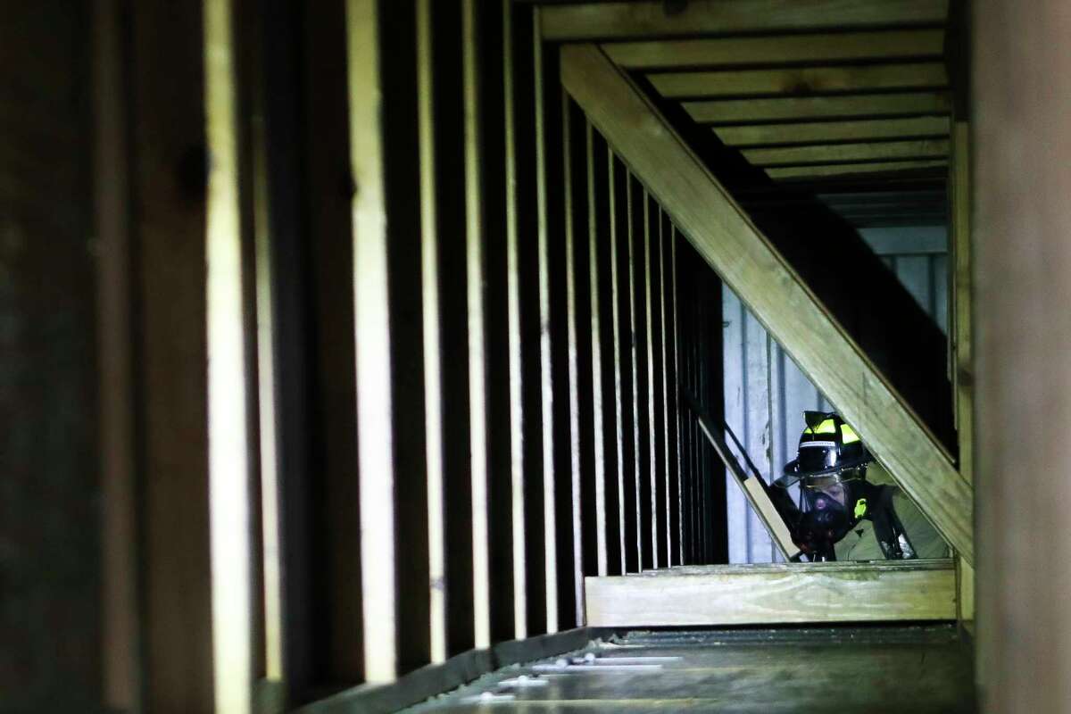 A cadet with The Woodlands Fire Department goes through an obstacle courses at The Woodlands Emergency Training Center, Tuesday, Jan. 31, 2023, in The Woodlands.