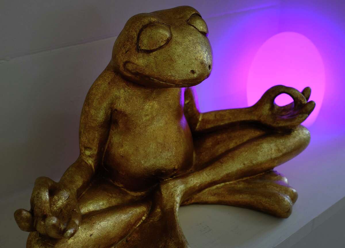 A meditating frog sculpture sets a zen mood.