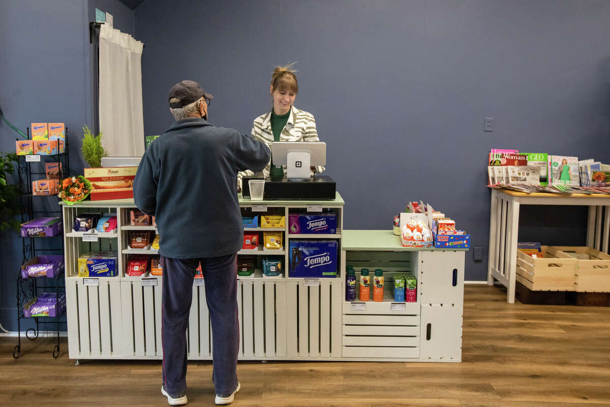 Lehr's German Specialties new owner Hannah Seyfert rings out a customer at the register at Lehr's German Specialties in the Noe Valley of San Francisco, Calif. on Jan. 29, 2023.