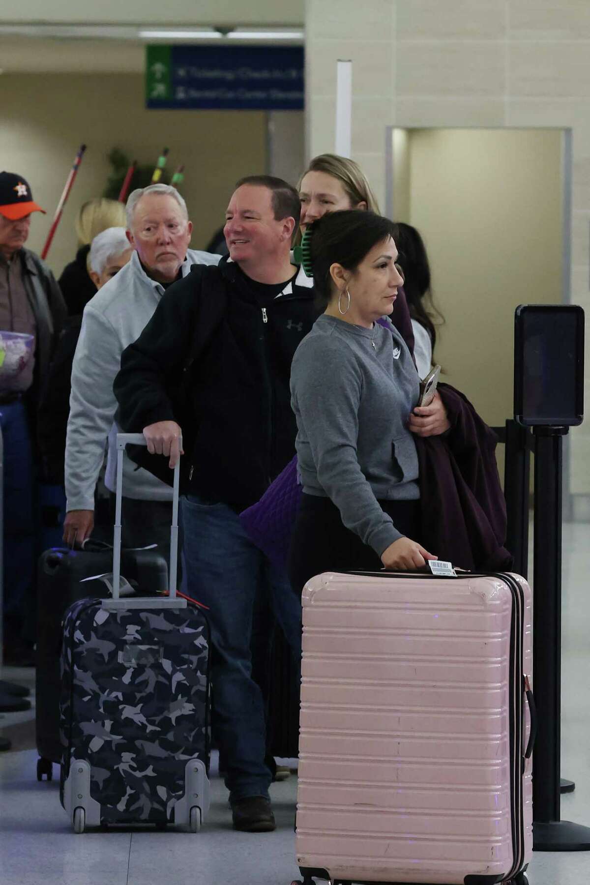 Passengers at the San Antonio International Airport, Tuesday, Jan. 31, 2023. A strong cold front has brought temperatures into the low 30’s causing icy road conditions. Southwest Airlines cancelled several flights to Dallas due to the weather.