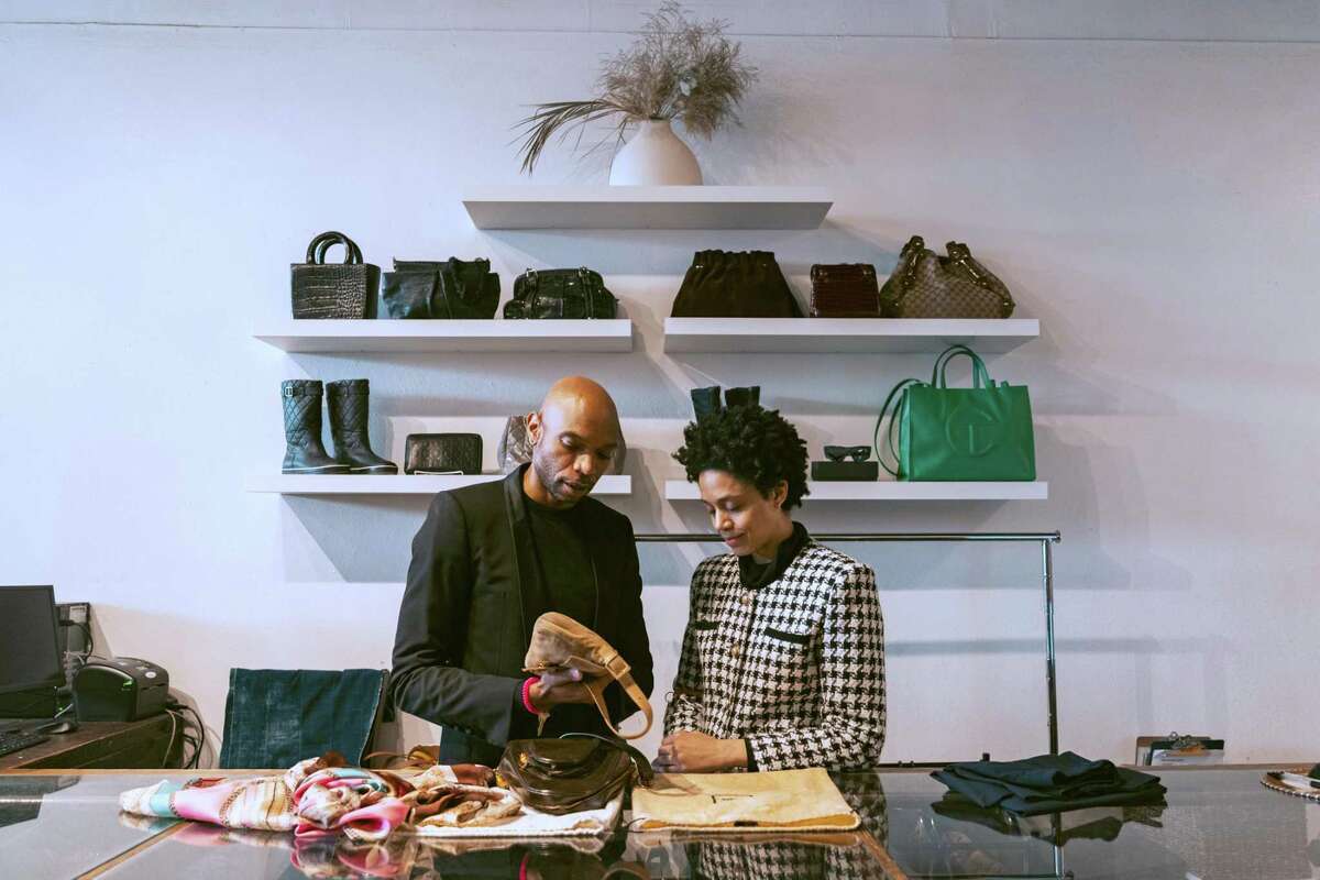 Michael Hillord (left) and Dominique Littleton (right) appraise an early 2000s Fendi baguette at ReLove in San Francisco on Saturday, Jan. 28, 2023. “These are the bags I coveted when I first got into fashion,” Hillord said.