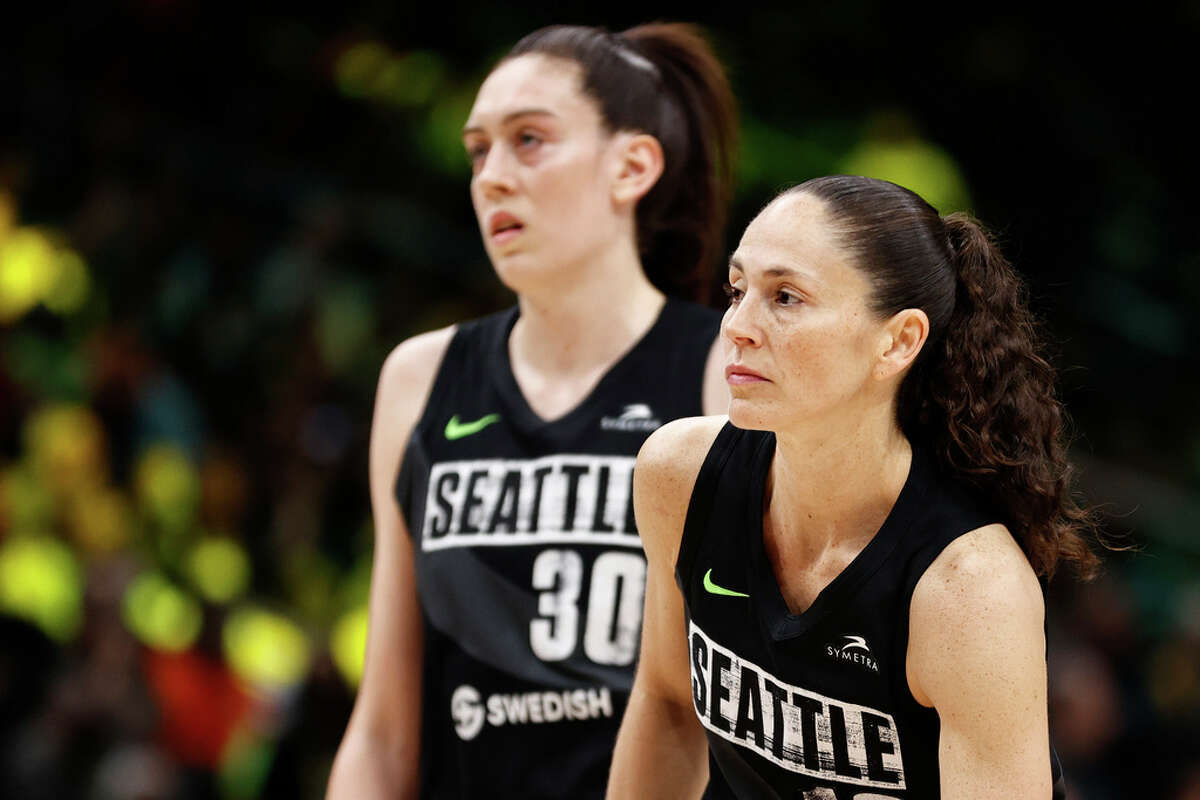 SEATTLE, WASHINGTON - JUNE 29: Breanna Stewart #30 and Sue Bird #10 of the Seattle Storm look on during the fourth quarter against the Las Vegas Aces at Climate Pledge Arena on June 29, 2022 in Seattle, Washington. (Photo by Steph Chambers/Getty Images)