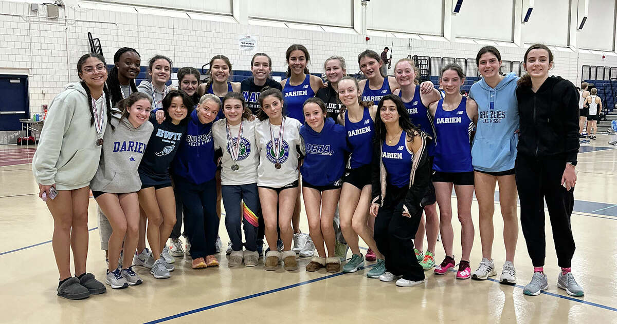 The Darien girls indoor track and field team after winning the FCIAC East Division championship in Wilton on Saturday, Jan. 28, 2023.