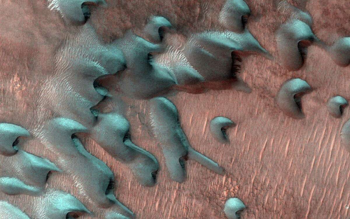 Here's what snow looks like on Mars and it’s nothing like on Earth. Martian dunes far north of the equator were covered with frost (blue, in this enhanced-color image) shortly after the winter solstice, as captured by NASA’s Mars Reconnaissance Orbiter on July 22, 2022.