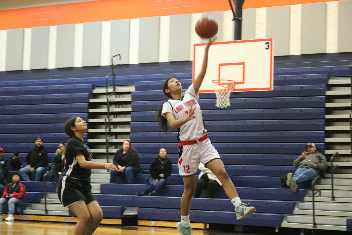 San Jacinto Intermediate's Ileanna Atrian (12) makes a graceful drive to the basket. She finished with six points, five rebounds and an assist.