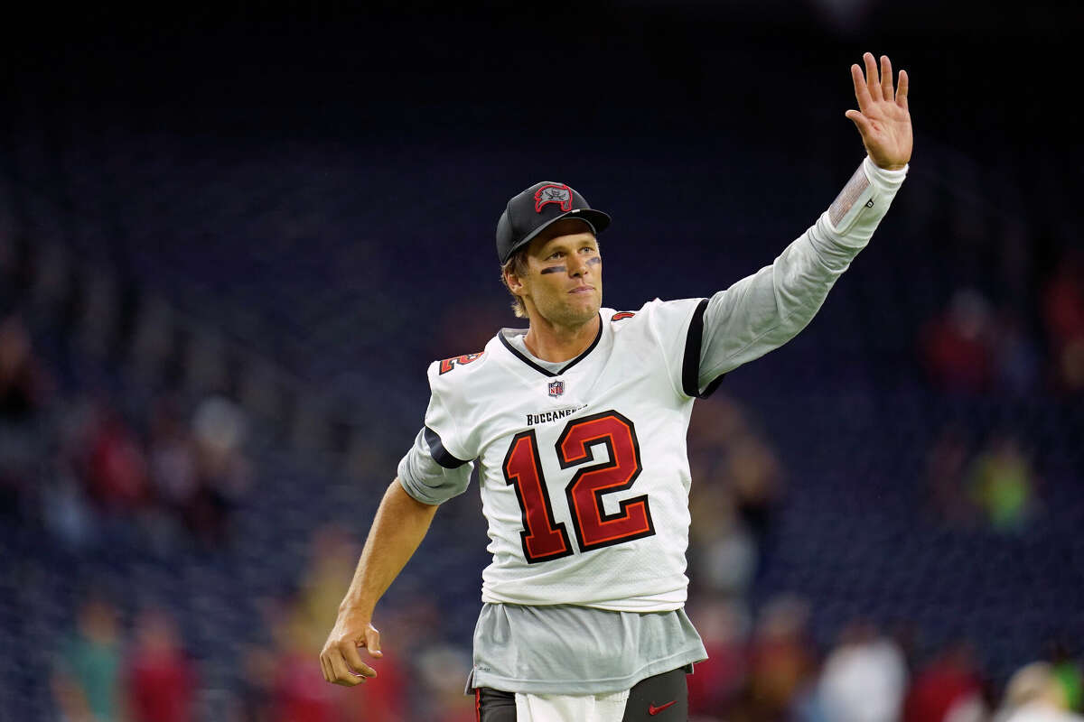 FILE - Tampa Bay Buccaneers quarterback Tom Brady (12) waves toward the fans as he leaves the field after an NFL preseason football game against the Houston Texans, Saturday, Aug. 28, 2021, in Houston. Tom Brady has retired after winning seven Super Bowls and setting numerous passing records in an unprecedented 22-year-career. He made the announcement, Tuesday, Feb. 1, 2022, in a long post on Instagram. (AP Photo/Matt Patterson, File)