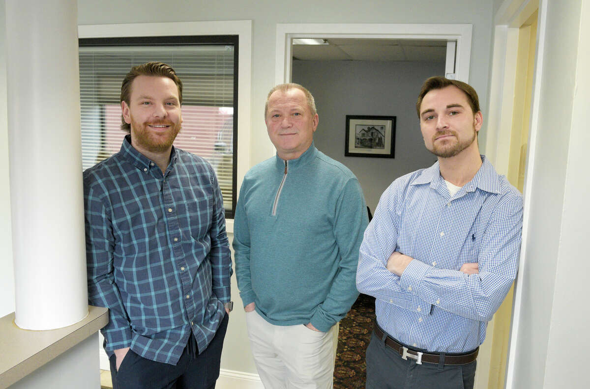 Arthur Stueck, founder of AssociationNation, flanked by company president Sean McVey, left, and Sam Stueck, on Tuesday at the startup's office in Danbury.