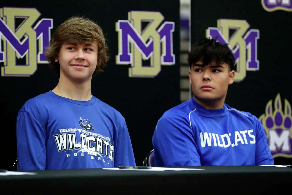 Brayden Stash, left, and Alex Acosta both signed to play football for Culver-Stockton College during a ceremony on National Singing Day at Montgomery High School, Wednesday, Feb. 1, 2023, in Montgomery. Eight athletes signed to play sports at the college level.