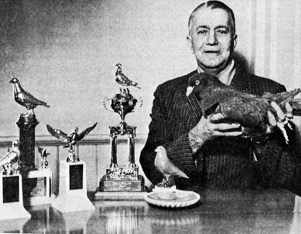 Ernest Schuelke, of 1314 Lakeshore Road., holds a red Giant Runt pigeon which won top honors as best in its class in the National Pigeon Show in St. Louis, Missouri recently. The photo was published in the News Advocate on Jan. 30, 1963.
