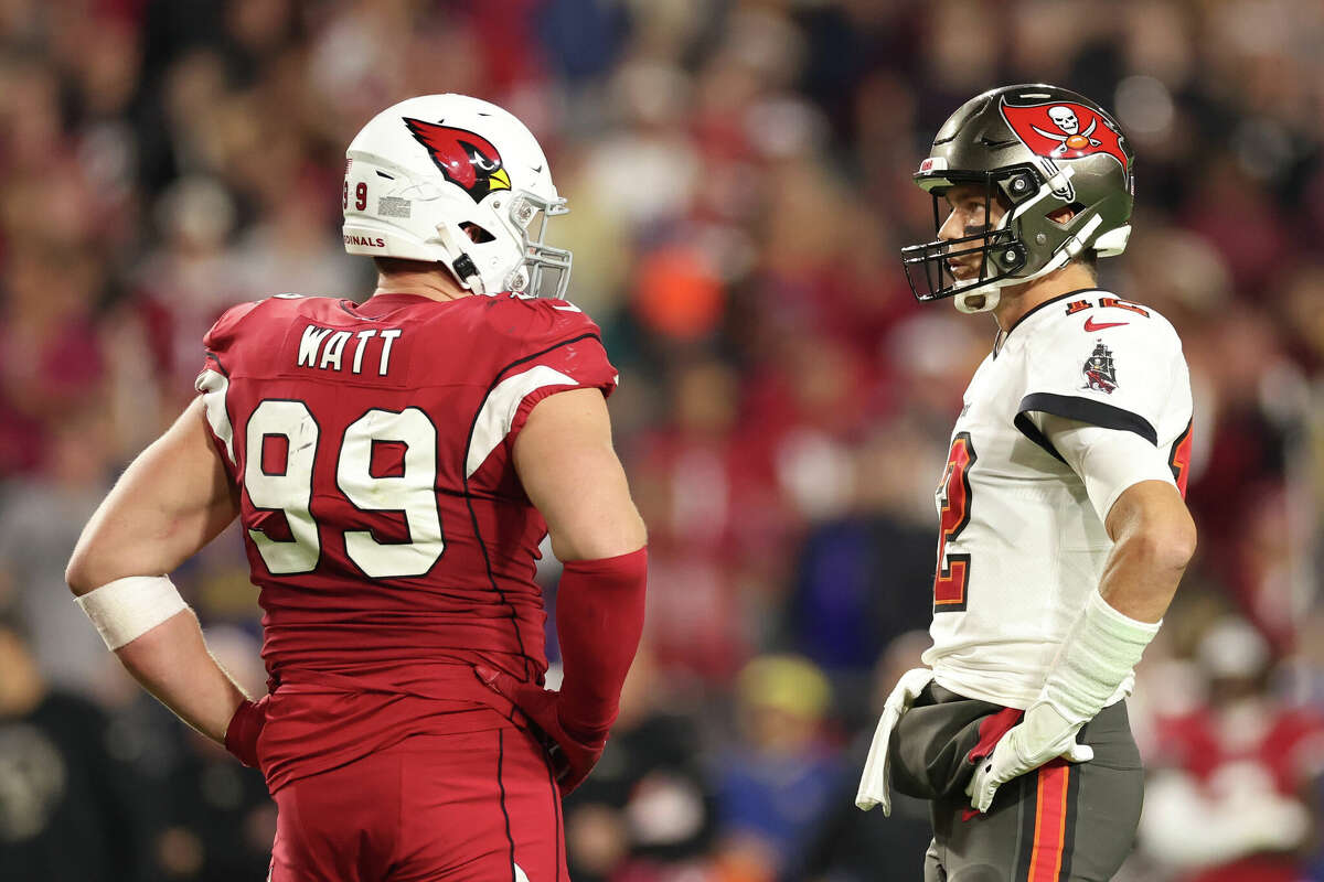 The Arizona Cardinals' J.J. Watt talks with Tampa Bay Buccaneers quarterback Tom Brady during a game on Dec. 25, 2022 in Glendale, Arizona. It ended up being the final time the two futue Hall of Famers faced each other on the field.