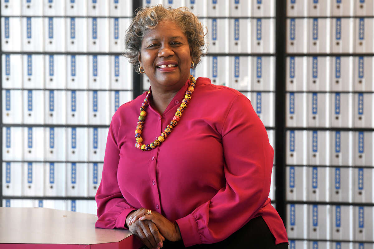 Postmaster Jeanette Sherrod poses at the United States Postal Service headquarters in Milford, Conn. Feb. 1, 2023.