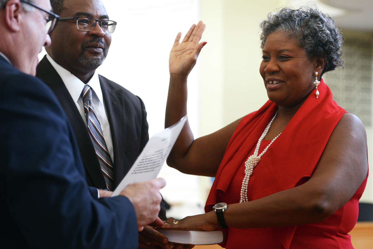 Jeanette Sherrod is sworn in as Postmaster for the City of Milford during a ceremony at City Hall, in Milford, Conn. Jan. 10, 2019. Sherrod is the city’s first African-American Female Postmaster.