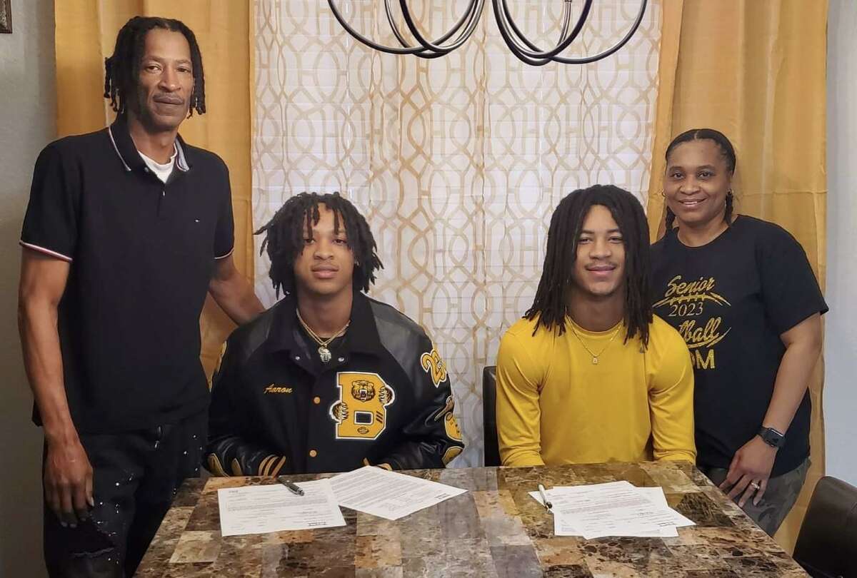 Flanked by their parents, Brennan twin brothers Aaron Dubose (left) and Ashton Dubose (right) signed with West Texas A&M football at their home on Wednesday, Feb. 1, 2023. Father is Rodney Dubose and mother is Antionetta Dubose.