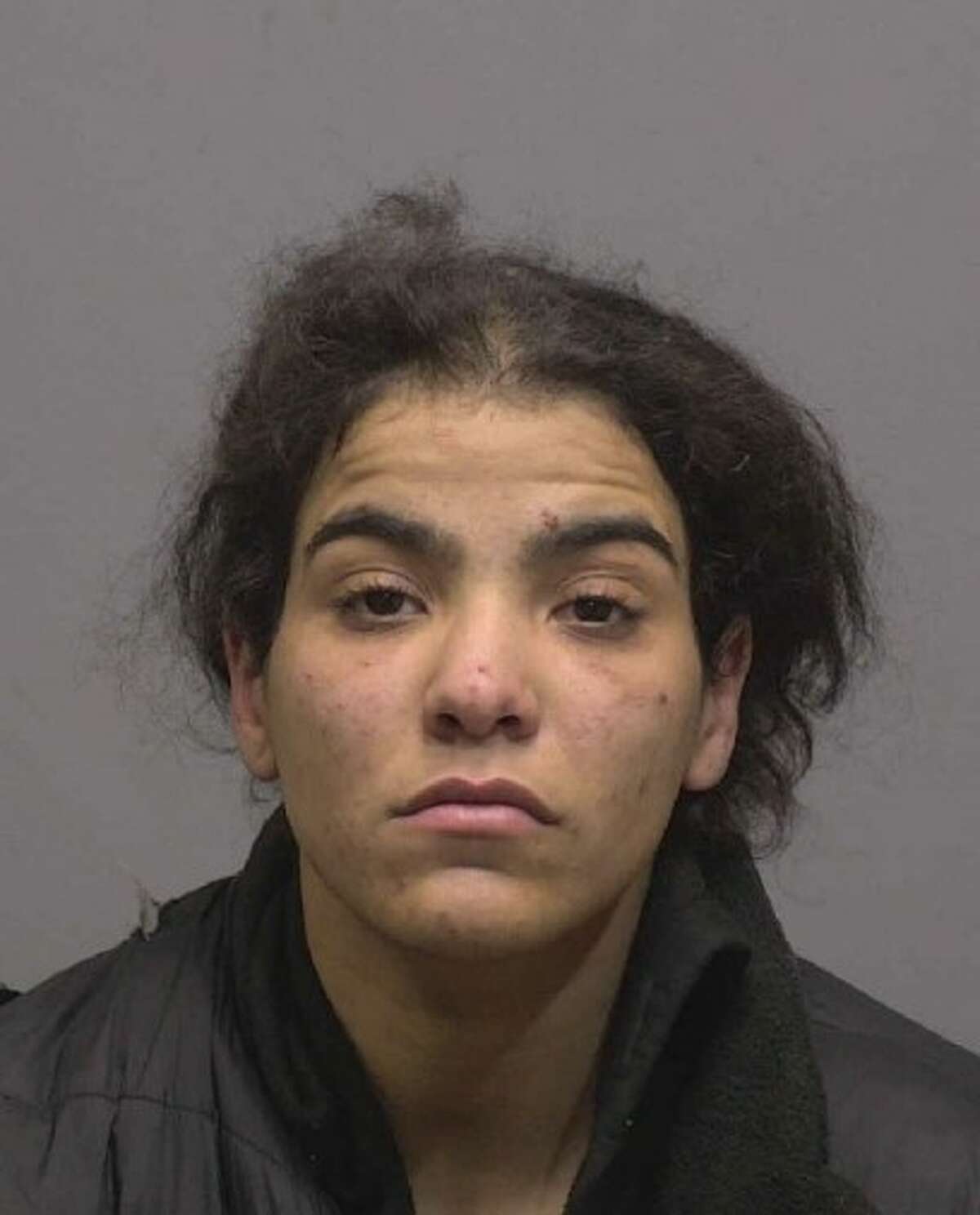 New Haven's Robetsy Quinones, 25, was found hiding in a dumpster with cocaine and drug paraphernalia after committing a robbery on Genesee Street on Tuesday afternoon, according to New Haven police. .