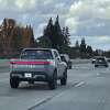 A Rivian electric pickup truck drives down the 680 Freeway in Danville, California on December 4, 2022. 