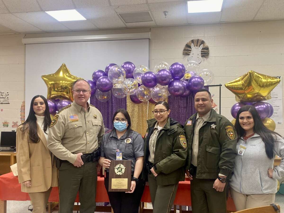 Chief Scott Avant from Webb County Sheriff's Office and Gilbert Aguilar, Mayor of Rio Bravo recognized Karina Ramos for her actions to save the life of one of her students at Juarez-Lincoln Elementary School on Wednesday, Feb. 1, 2023.