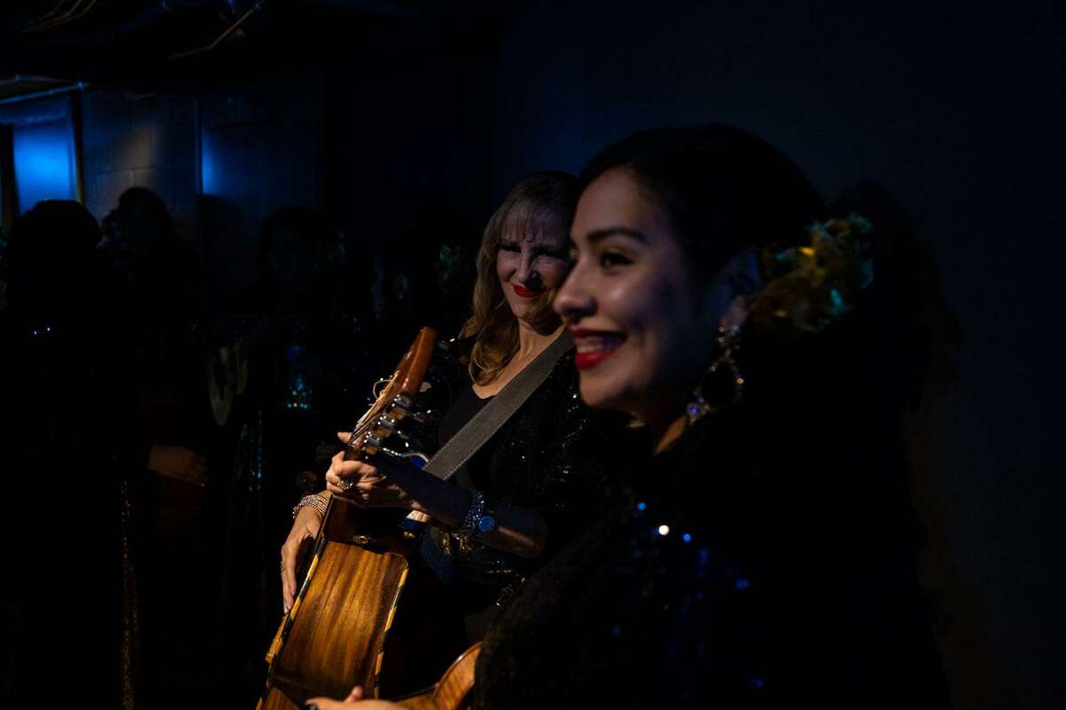 Members of the Mariachi Las Valquirias tune their instruments before performing the National Anthem with Gola at the Mayor’s Dream Ball at the Tobin Center on Saturday evening. (Kaylee Greenlee Beal/Contributor)