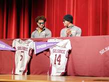Silsbee brothers Mason Brisbane (left) and Max Brisbane sign to play college football at Mary Hardin-Baylor on Wednesday. 