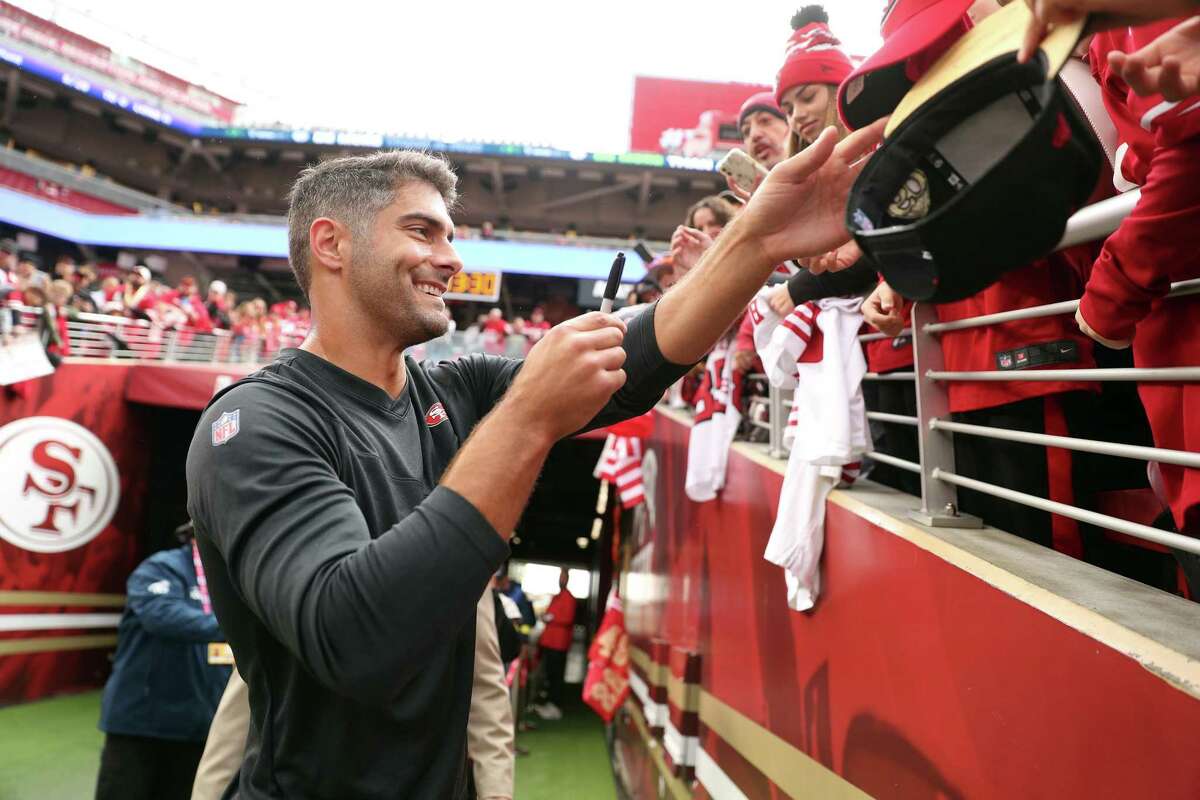 San Francisco 49ers’ Jimmy Garoppolo signs an autograph before playing the Miami Dolphins on Dec. 4. Garoppolo suffered a season-ending broken foot in the first quarter of the game.