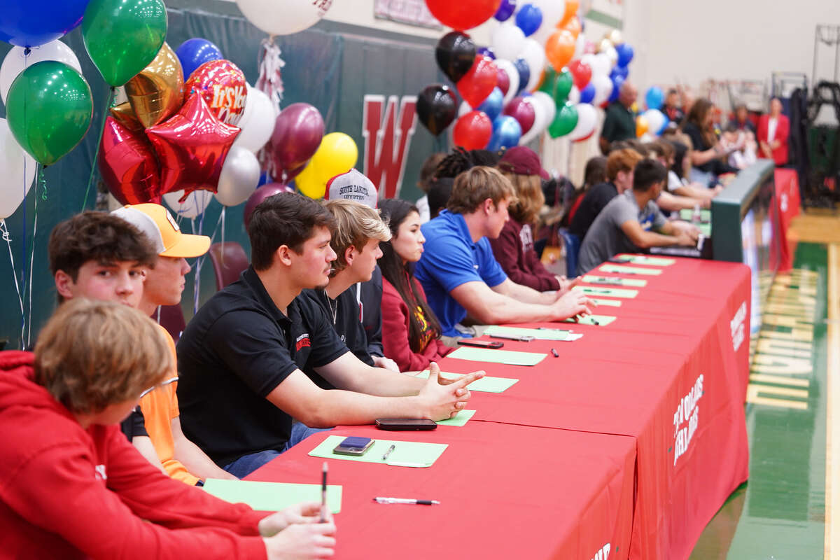 The Woodlands student athletes are seen during the National Signing Day ceremony Wednesday, Feb. 1, 2023 at The Woodlands High School.