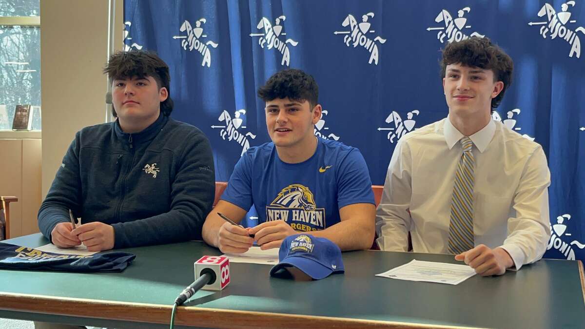 Ansonia captains (left-to-right) Alex Romanowski, David Cassetti Jr. and Chris Kaminski during their National Signing Day Ceremony at Ansonia High School, Wednesday, Feb. 1, 2023.